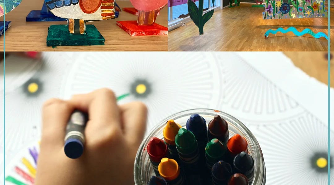 En hånd som tegner med fargestifter, og kunst som barna har laget.
